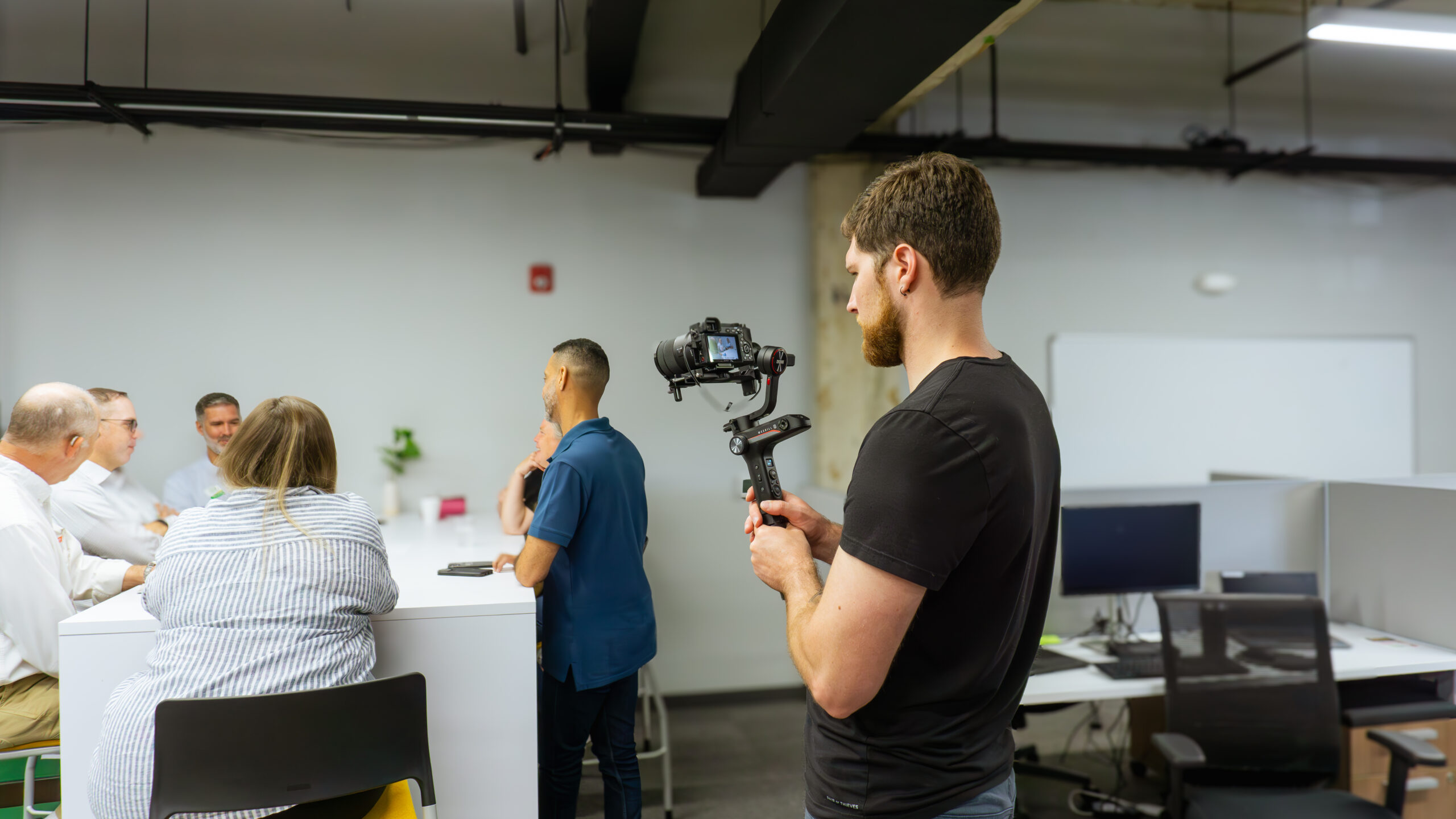 man filming with camera on gimbal