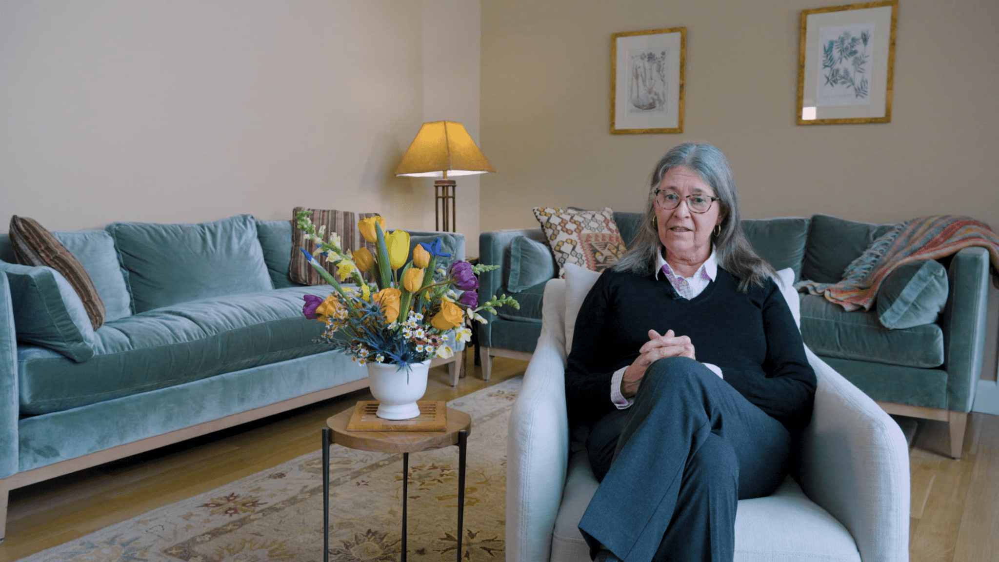 Woman sitting for an on camera interview speaking